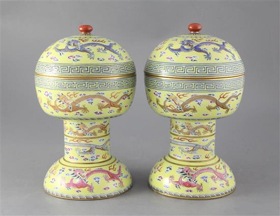 A pair of Chinese yellow ground altar vessels and covers, dou, iron red Daoguang seal marks and of the period (1821-50), height 27.5cm,